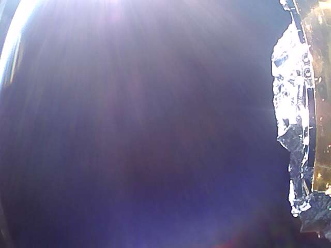 A picture of space from CatSat showing a partially inflated antenna